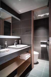 a bathroom with a sink and a toilet at KIORI Hotel Takakura in Kyoto +52 photos
