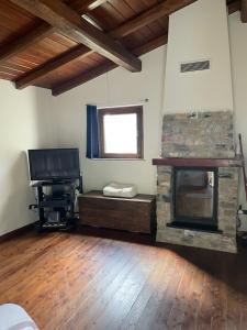 TV a/nebo společenská místnost v ubytování Casa San Bartolomeo