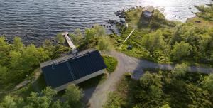 an overhead view of a building next to the water at Lapland Hotels Kilpis in Kilpisjärvi