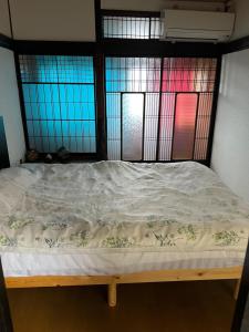 Postel nebo postele na pokoji v ubytování 橋本の香