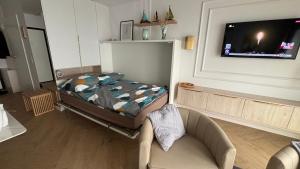 En eller flere senge i et værelse på Apartament Gdynia Żeromskiego