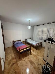 Postel nebo postele na pokoji v ubytování Royal Corner Apartments