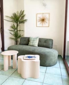 a living room with a couch and a table at Hotel Residence Eden in Palinuro