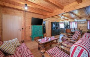 a living room with furniture and a television in a cabin at Villa Luna - Ludbreg by Villas Guide in Ludbreg