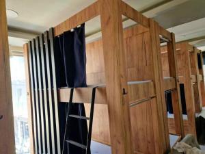 a room with a door and a ladder in a room at Hostel Central in Hersonissos