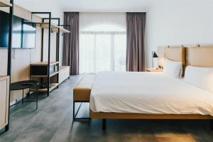 Voodi või voodid majutusasutuse Cavalieri Art Hotel, a member of Radisson Individuals toas