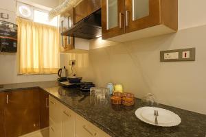 a kitchen with a counter top with a plate on it at O2 stay in Jaipur