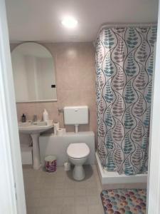 a bathroom with a toilet and a sink at Dolce Riposo in Trani +10 photos