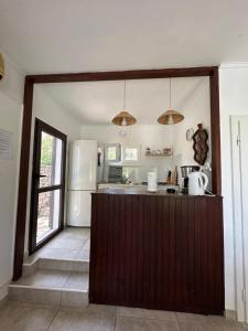 a kitchen with a counter and a refrigerator at House Neli in Srednje Selo na Šolti