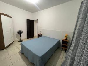 En eller flere senge i et værelse på Minha Casa Seu Lar