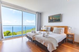 En eller flere senge i et værelse på Cape View Villa by Atlantic Holiday + 36 billeder