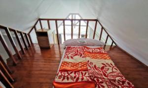 a bed sitting in the middle of a room at Napospart 32 in Balatonlelle