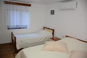 Postel nebo postele na pokoji v ubytování Guest House Marsi