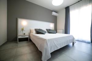 מיטה או מיטות בחדר ב-Sikania Casa Diamond