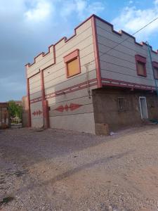 a building with a painting on the side of it at GuestHouse Gafait in Guefaït