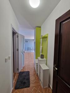 a hallway with a room with green and white walls at LOVE 2 apartment in Aheloy
