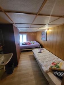 Ένα ή περισσότερα κρεβάτια σε δωμάτιο στο Chez Berni