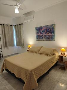 Ένα ή περισσότερα κρεβάτια σε δωμάτιο στο Jardim das Mangueiras