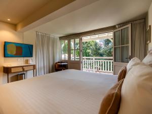Cama ou camas em um quarto em La Villa du Moulleau