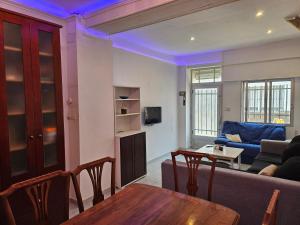 a living room with a couch and a table at Habitacion en Casa compartida in Bellreguart