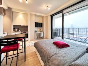 a bedroom with a bed and a large window at BW City Elegance Collection in Belgrade