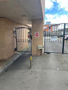 an entrance to a parking garage with a gate at Plush maisonette in Southampton