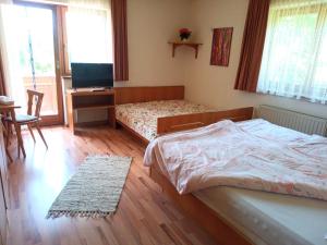 Posteľ alebo postele v izbe v ubytovaní Haus Christof private Ferienwohnungen Nähe Wörthersee und Ossiacher See