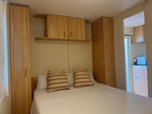 a bed with two pillows on it in a room at Camping Moraira in Moraira