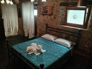 Una cama o camas en una habitación de Da Castruccio degli Antelminelli