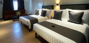 Letto o letti in una camera di PROXY Plus Pangasinan