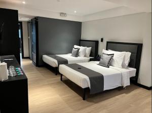 Letto o letti in una camera di PROXY Plus Pangasinan