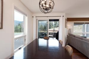 a living room with a table and a couch at Pine Acres - Unit 102 in Hermosa