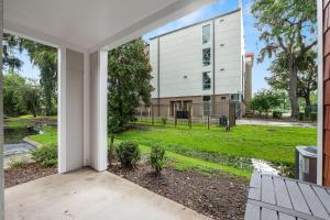 an open door to a building with a yard at UF Apartment on Archer Road Near Shands & VA ! in Gainesville
