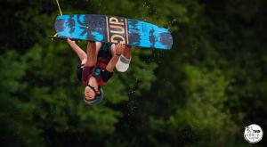 a man is doing a trick on a board in the air at Chez Fleur in Avignon