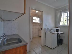 Η κουζίνα ή μικρή κουζίνα στο Aintree Lodge