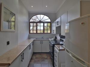 Η κουζίνα ή μικρή κουζίνα στο Aintree Lodge