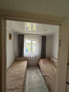 Voodi või voodid majutusasutuse Дом посуточно в Боровом toas