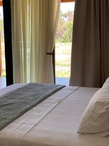 Letto o letti in una camera di Nettuno Resort Orikum