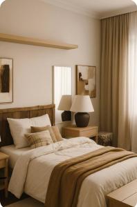 a bedroom with a large bed and a lamp at Stay&view Santarém in Santarém