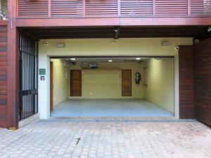 an empty garage with a large door in a building at Table Mountain Villa in Cape Town