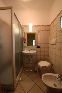 a bathroom with a toilet and a sink at B&B Don Gino in Monopoli +39 photos