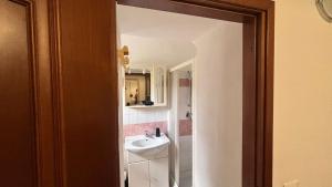 a bathroom with a sink and a mirror at La Spezia stazione centrale - via dei colli in La Spezia