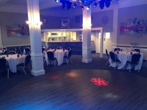 a dining room with tables and chairs in a room at The Clyffe Hotel in Lowestoft