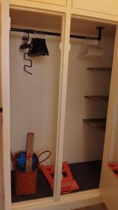a closet with a cupboard with some items in it at A 2 pas des iles à Concarneau in Concarneau +4 photos