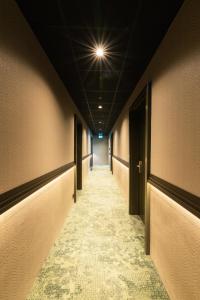 a long hallway with a light on the ceiling at Centrum Hotel in Akureyri
