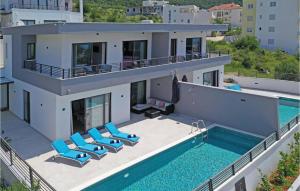 an aerial view of a house with a swimming pool at 3 Bedroom Awesome Home In Makarska in Makarska +19 photos
