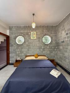 Ένα ή περισσότερα κρεβάτια σε δωμάτιο στο 1 room in a Bungalow with Lounge area,Kitchenette & terrace in Ulsoor