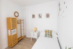 Ένα ή περισσότερα κρεβάτια σε δωμάτιο στο TrendyHomes El Faro de Almería