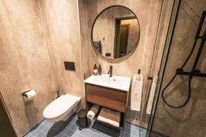 a bathroom with a sink and a mirror at Centrum Hotel in Akureyri