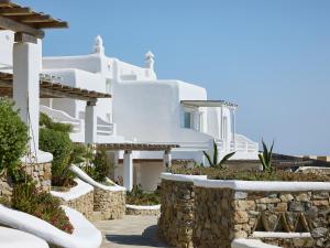 a view of the side of a white villa at Mykonos Lolita, a Resort to Live in Agios Sostis Mykonos